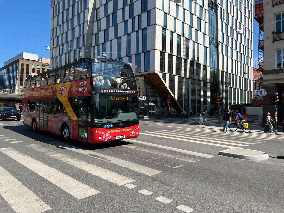 Red hop-on hop-off sightseeing bus in Stockholm