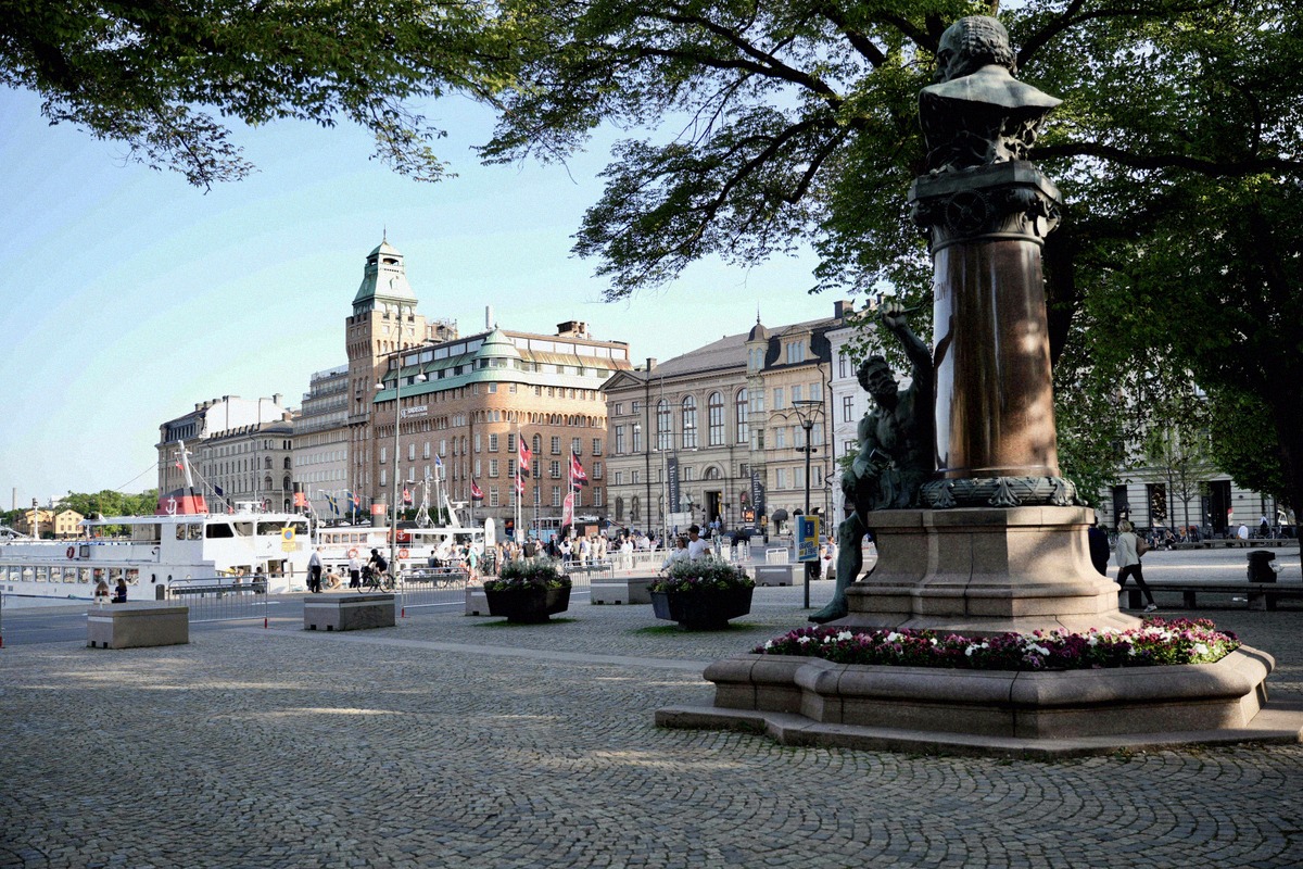 Kungsträdgården with its fountain and a view towards the harbour of Stockholm